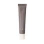 A grey squeeze tube labeled Indie Lee Bronzing Drops in white text with a white cap stands upright on a white background. The back of the tube shows product info and icons, highlighting its promise of a perfect summer glow.