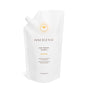 A white refill pouch of Innersense Organic Beauty Pure Harmony Hairbath, a sulfate-free shampoo, features a side spout, gold sunburst design, and upright stance against a white background.