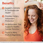 A smiling woman with long red hair stands outdoors. Text beside her highlights Jarrow Quercetin 500mg - Bioflavonoid, Veggie Caps: antioxidant support for immune and cardiovascular health, cell protection, and overall wellness.