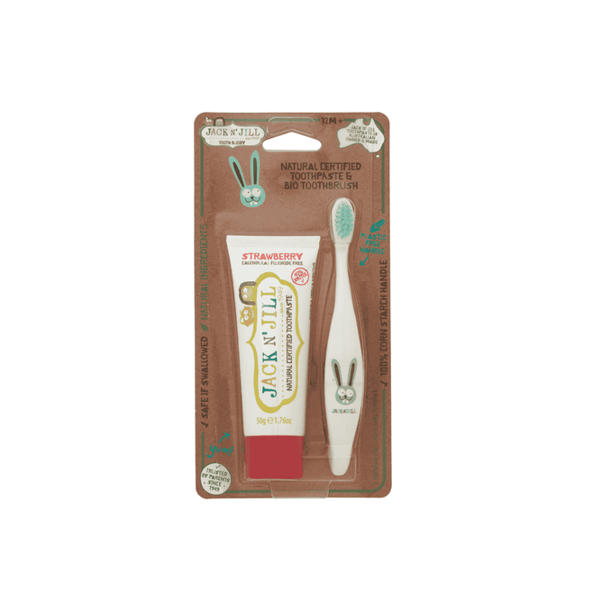 The Jack N Jill Tooth Buddy Pack includes a fluoride-free strawberry kids toothpaste and a white bio toothbrush with a cute bunny design, all in eco-friendly packaging on brown cardboard backing.