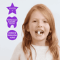 A smiling young girl with long red hair holds two Jack N’ Jill Tooth Sparkles Chewable Teeth Cleaning Tablets on her tongue. Next to her, purple icons show Xylitol, Kids Tooth Supplements, Chew & Swallow, and Yum! against a plain background.