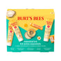 The Burts Bees Essentials Kit includes five travel-size products: body lotion, hand salve, lip balm, foot cream, and deep cleansing cream. The yellow box displays product images with English and French text.