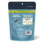 A blue resealable bag of Jiminy's Chewy Peanut Butter & Cranberry Training Treats highlights eco-friendly benefits, grub protein, and a chart comparing emissions. Allergy-friendly dog treats and nutritional details appear below.