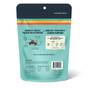 Back of resealable Jiminy's Crunchy Original Cricket Dog Treat bag with text on protein-packed, grain-free treats made with cricket protein. Includes icons, greenhouse gas chart, ingredients, nutrition facts, barcode & social media info.