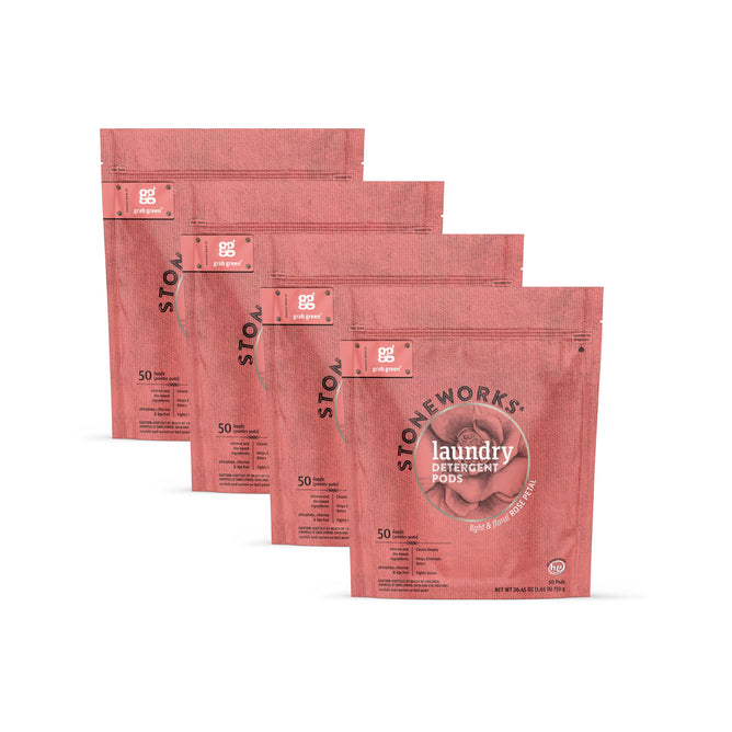 Four pinkish-red resealable pouches of grab green Stoneworks Laundry Detergent Pods – Rose Petal are displayed in a row, each labeled for 50 loads and featuring a circular logo promoting deep cleaning and odor neutralizing.