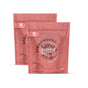 Two pink grab green Stoneworks Laundry Detergent Pods - Rose Petal pouches stand upright. Each resealable pouch holds 50 deep cleaning pods with a light, floral rose petal scent and features branding on the front.