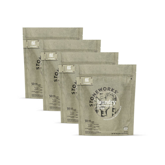 Four beige pouches of grab green Stoneworks Laundry Detergent Pods - Birch Branch, each labeled for 50 pods and featuring nature-inspired branding, are arranged in a staggered row on a white background.