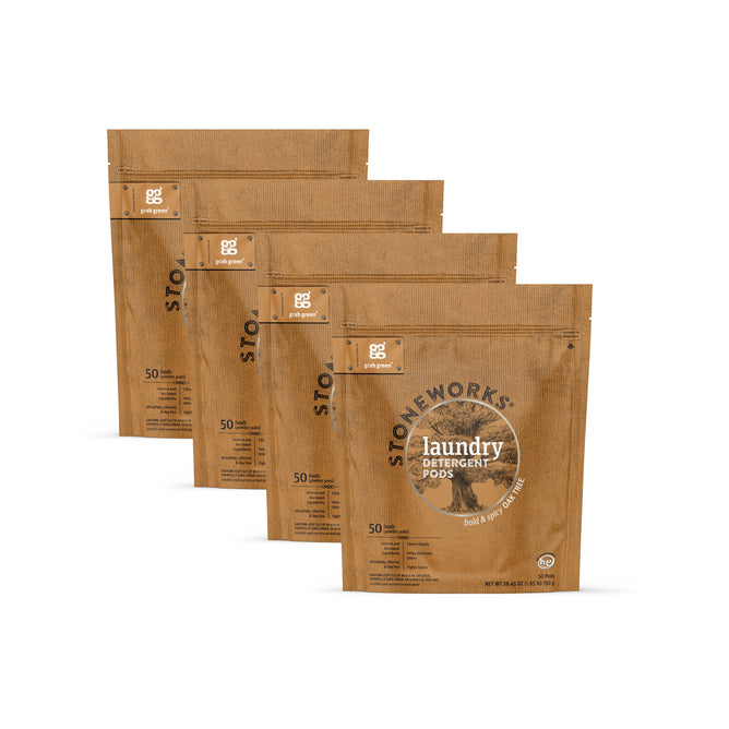 Four brown, resealable grab green Stoneworks Laundry Detergent Pods - Oak Tree bags are arranged diagonally. Each has black and white text, a circular logo, and contains 50 pods to neutralize odors for clean clothes.