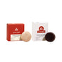 Two boxes with the Good Juju Body & Home logo are shown side by side, each paired with a round bar: the left shows a red and beige Volumizing Shampoo Bar, the right a white and dark brown Volumizing Conditioner Bar from the Volumizing Haircare Set.