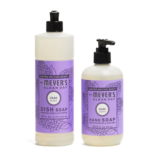 The Mrs. Meyer's Spring Awakening Hand and Dish Soap Duo includes a dish soap with flip cap and a hand soap with pump dispenser, both featuring purple floral labels and a refreshing scent.