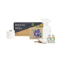 Displayed on a white background is the Grove Co. Highest Impact Swaps Gift Set by Grove Collaborative, featuring a roll of bamboo toilet paper, a box labeled Grove Co. Tree-Free Toilet Paper, a spray bottle of multi-purpose cleaner concentrate, laundry detergent sheets, two bottles of cleaning solution, and two cleaning sponges.
