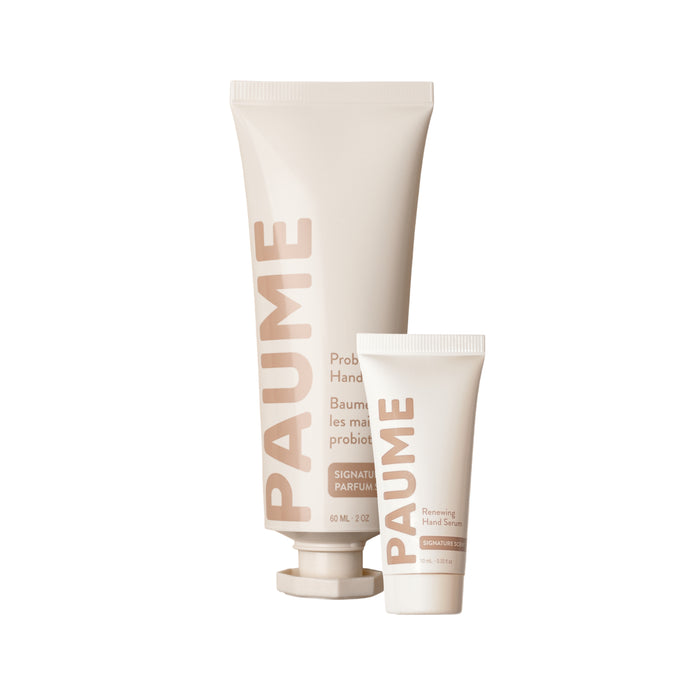 A large tube of PAUME Probiotic Hand Balm and a smaller tube of Renewing Hand Serum.