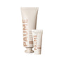 A large tube of PAUME Probiotic Hand Balm and a smaller tube of Renewing Hand Serum.