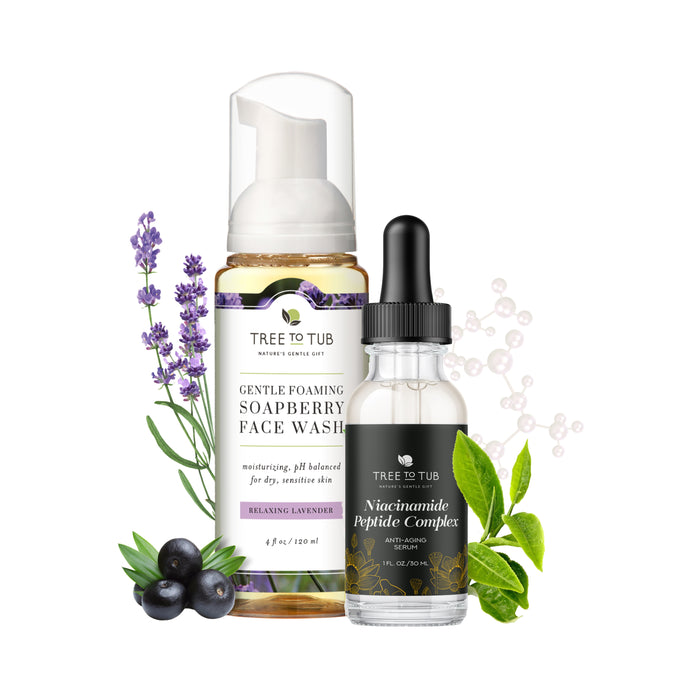 A bottle of Tree To Tub Buy Hydrating Face Wash, Get Anti-Aging Peptide & Niacinamide Serum FREE, surrounded by sprigs of lavender, soapberries, and green leaves.