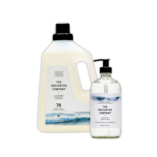 Two minimalist bottles from The Unscented Company: a large fragrance-free laundry detergent with black cap and a smaller hand soap, featured in the “Buy Laundry Detergent, Get a Hand Soap Free” offer—both displaying wave imagery.
