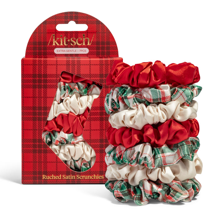The Kitsch Holiday Ruched Satin Scrunchies Gift Set includes seven satin scrunchies in red, white, and green plaid—perfect for styling or gifting as festive holiday hair ties.