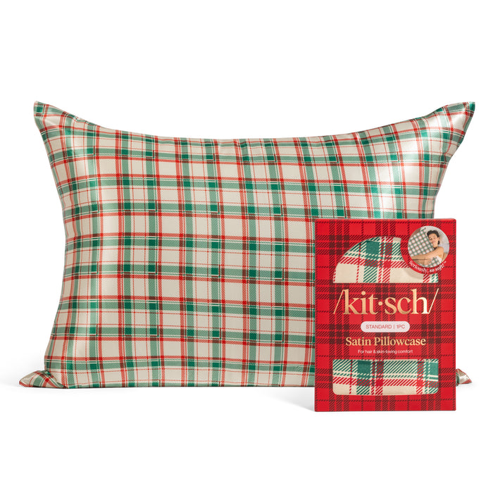 The Standard Satin Pillowcase - Holiday Edition by Kitsch is displayed in festive red, green, and white plaid with matching packaging featuring the Kitsch brand and beauty sleep details.