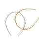 The Zigzag Headbands Holiday Set - Recycled Plastic by Kitsch features silver and gold textured zigzag headbands with raised dots, arranged in a stylish overlap—perfect festive hair accessories on a white background.