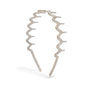 The Zigzag Headbands Holiday Set - Recycled Plastic by Kitsch features translucent, glittery headbands that stand upright—perfect festive hair accessories.
