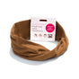A KOOSHOO Organic Twist Headband in brown is shown with its packaging, emphasizing this plant-based, sustainable accessory. The package displays multiple ways to wear the ethically made headband.
