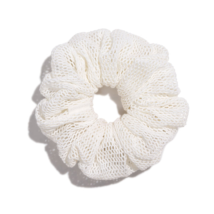 The KOOSHOO Honeycomb Scrunchie, made from organic cotton in a mesh weave, sits on a white background with a soft shadow.