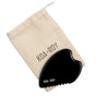 The Large Black Obsidian Body Gua Sha Tool by KOA + ROY rests on a beige drawstring pouch with the brand name, inspired by traditional Chinese medicine for effective lymphatic drainage.