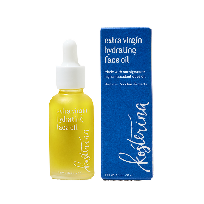 A bottle of Kosterina Extra Virgin Hydrating Face Oil with a dropper sits beside its blue box, which displays the product name—formulated with extra virgin olive oil to deliver natural hydration for your complexion.
