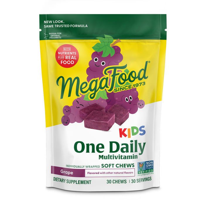 A colorful bag of MegaFood Kids One Daily Multivitamin Soft Chews in grape flavor, featuring cartoon grapes and purple chews. The package highlights Non-GMO, nutritional support, and nutrients plus real food.