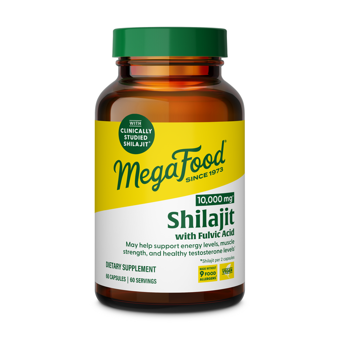 A bottle of MegaFood Shilajit dietary supplement with a yellow and green label, containing 60 capsules (10,000 mg) to support energy, muscle strength, and healthy testosterone.