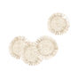 The LIKHA Raffia Fringe Coasters, set of 4, are round and beige with fringed edges, displayed on a white background—three overlapping at the bottom left, one placed apart at the top right.