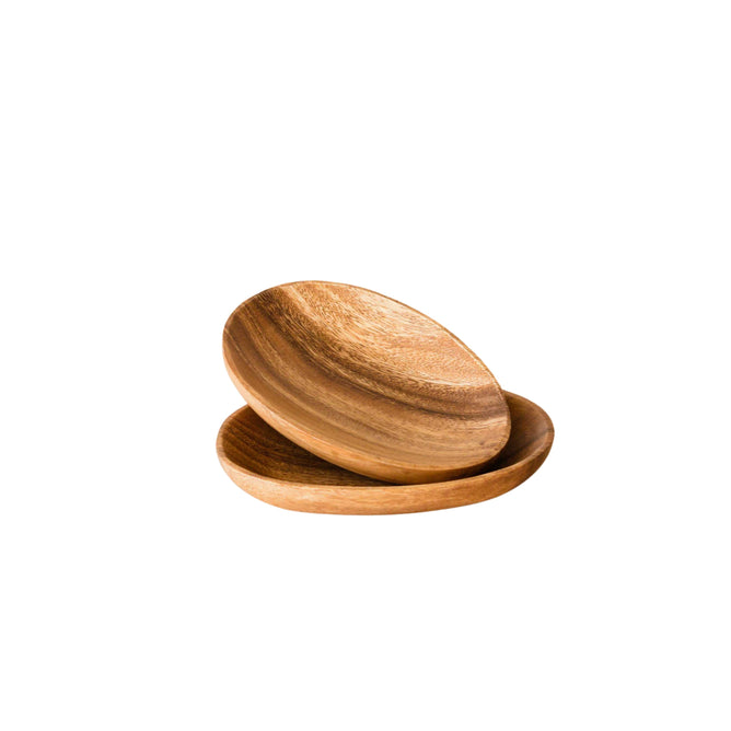Two LIKHA Acacia Oval Plates, 7 each, are stacked against a white background, showcasing natural wood grain and brown tones that reflect their ethically made and sustainably sourced craftsmanship. Set of 2.