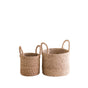 The LIKHA Abaca Cylinder Tabletop Basket with Handles, a nested set of 2 in mini and large sizes, is crafted from natural Manila hemp and features sturdy handles for easy carrying.