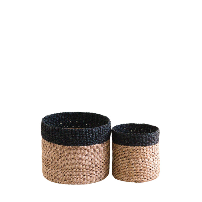 The LIKHA Abaca Cylinder Tabletop Basket, a nested set of 2 ethically made baskets handwoven from sustainable Manila hemp, is shown side by side on a white background with the larger basket on the left.