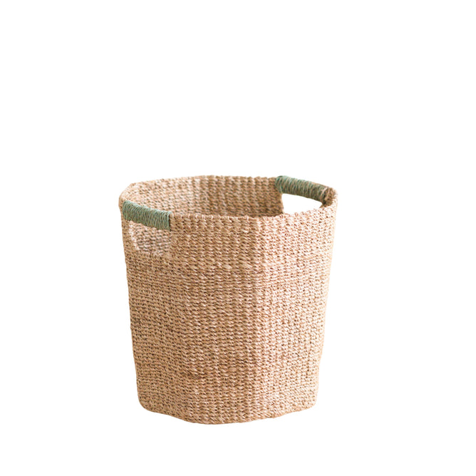 The LIKHA Abaca Octagon Basket is crafted from ethically made abaca fiber, features two green handles, and is displayed against a white background.
