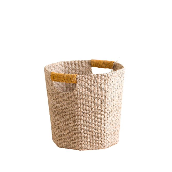 The LIKHA Abaca Octagon Basket, made from sustainable Manila hemp with two yellow-twine-wrapped handles, brings eco-friendly charm to any space. Ethically crafted, this natural mustard yellow piece is perfect for stylish, conscious decor.