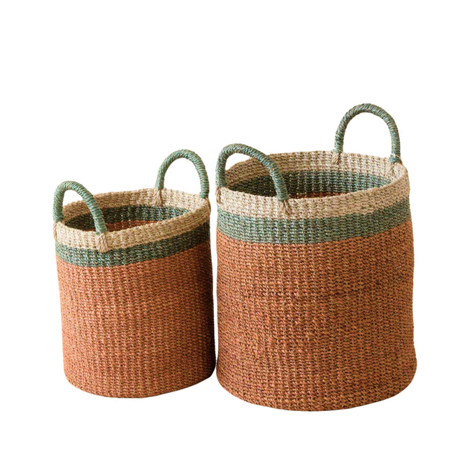 The LIKHA Abaca Cylinder Basket with handles, a nested set of 2 in varying sizes, showcases green and natural rims with reddish-brown Manila hemp fiber bodies, displayed side by side on a white background.