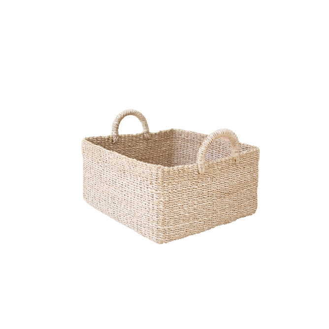 The LIKHA Abaca Square Tabletop Basket with Handles is a handwoven basket made from natural fibers, featuring two rounded handles and shown against a white background.