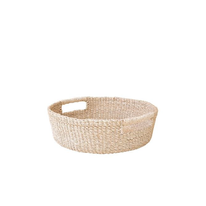 The LIKHA Abaca Round Tray with Cutout Handles is a handcrafted tray made from natural abaca, featuring two rectangular handles on opposite sides, shown on a white background.