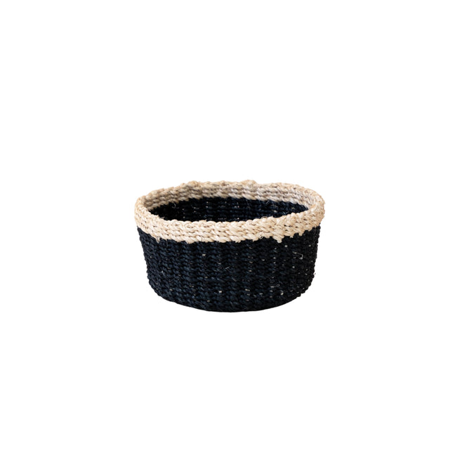 The LIKHA Abaca Mini Trinket Basket is a round, woven design made from sturdy Abaca fiber with a black body and contrasting light beige rim, shown against a plain white background.