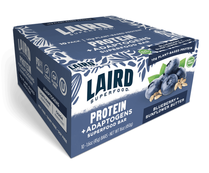 A blue box of Laird Superfood Blueberry Sunflower Butter Protein Bars features plant-based, gluten-free, and nut-free bars. The packaging displays images of blueberries and sunflower seeds to highlight the real-food ingredients.