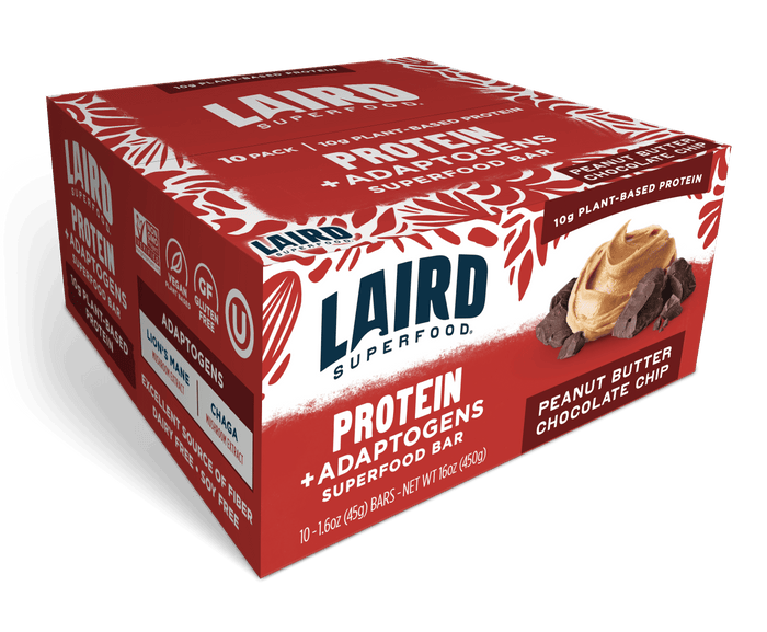 A red and white box of Laird Superfood Peanut Butter Chocolate Chip Protein Bars, gluten-free and vegan, packed with plant proteins and superfoods, featuring chocolate pieces and peanut butter on the packaging.