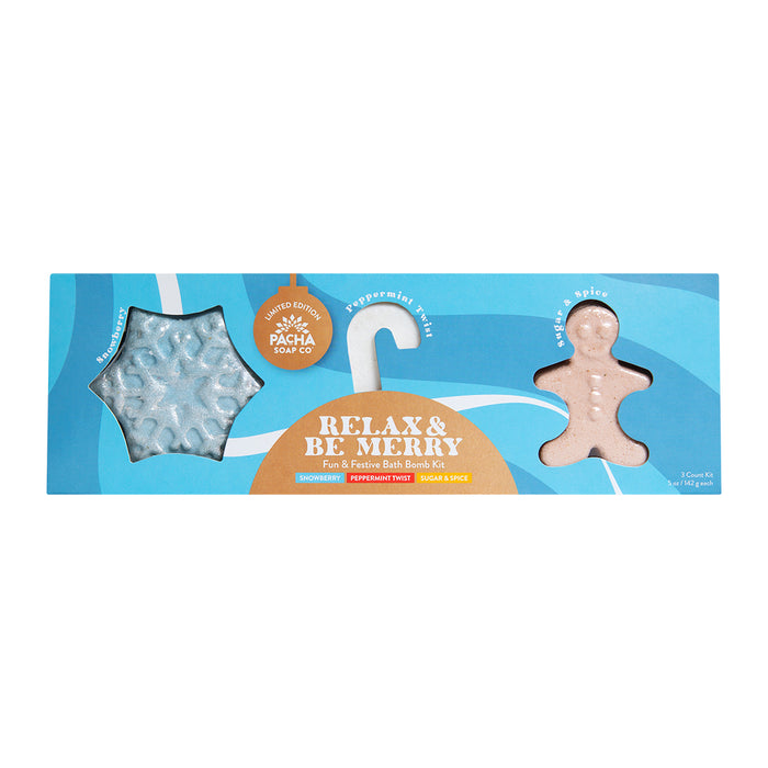 The Pacha Soap Co. Relax & Be Merry Bath Bomb Gift Set features a blue rectangular holiday box with festive bath bombs—a snowflake and gingerbread man—infused with snowberry, peppermint twist, and sugar & spice scents for a relaxing soak.