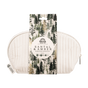 A Pacha Soap Co. Essentials Bath Gift Set in a zippered white toiletry bag, featuring a pine tree paper band and contents including a four-ounce Santal & Amber bar soap, five-ounce bath bomb, and three-ounce candle.