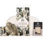 Pacha Soap Co. Essentials Bath Gift Set including an amber fragrance sandalwood candle, a cactus-shaped bath bomb, a boxed bar of soap, and a tall gift card, arranged in front of a white zippered pouch.