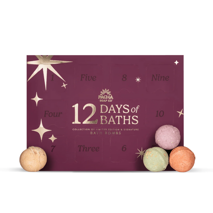 A deep purple 12 Days Of Baths Advent Calendar box with twelve perforated windows, gold lettering, and star accents, with three moisturizing bath bombs placed in front.