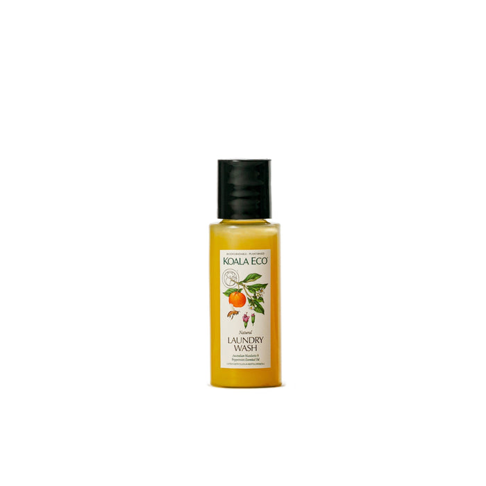 A small bottle of Koala Eco Laundry Wash - Sample with a black cap and a label featuring orange slices, leaves, and flowers. This eco-friendly formula contains natural essential oils and non-toxic ingredients.