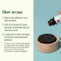 A hand holds a Plant Therapy Lava Rock Passive Diffuser essential oil bottle above the round black diffuser, which sits in a wooden holder, while usage and cleaning instructions appear on the left.