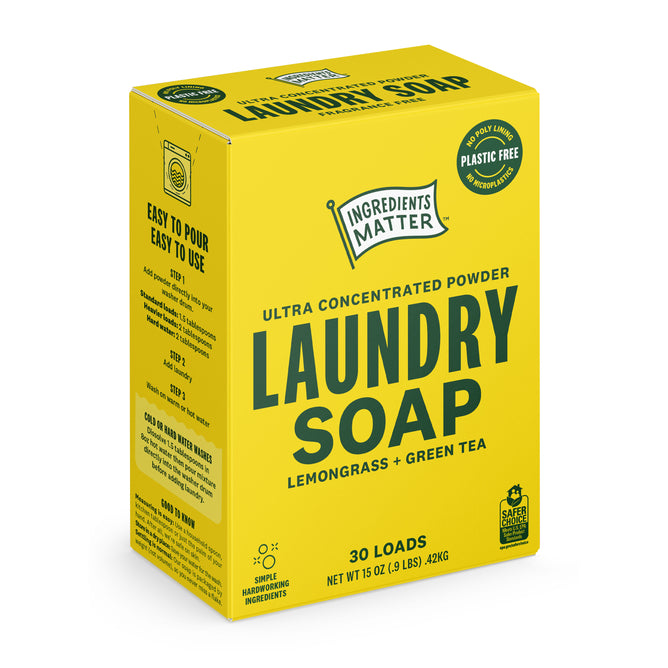 A yellow box of Ingredients Matter Laundry Soap Powder 30 Load in lemongrass green tea scent, labeled plastic-free and hypoallergenic, highlights its ultra-concentrated, easy-to-use, and eco-friendly laundry detergent benefits.
