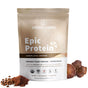 Sprout Livings Epic Protein Complete Coffee features a brown and white package for its vegan protein powder, adorned with certification badges. Organic ingredients, including coffee beans and mushrooms, are displayed elegantly beside it as part of the superfoods showcased.