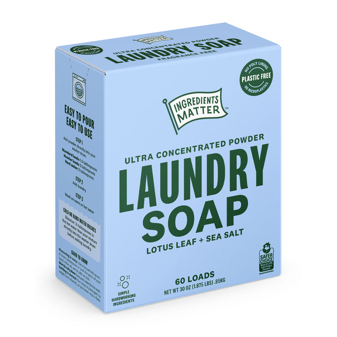 A blue box of Ingredients Matter Laundry Soap Powder 60 Load, a plastic-free detergent in Lotus Leaf + Sea Salt scent, with easy-pour instructions and ingredients listed on the side.